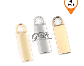 May include: Three metal craft supplies in gold, silver, and gold-tone. Each has a rectangular body with a rounded top and a small loop. The image includes a graphic that says "4 PCS" in an orange location marker.