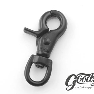 May include: Black metal swivel snap hook with a spring-loaded gate. The hook is designed for attaching to a variety of items, such as keychains, bags, and straps.