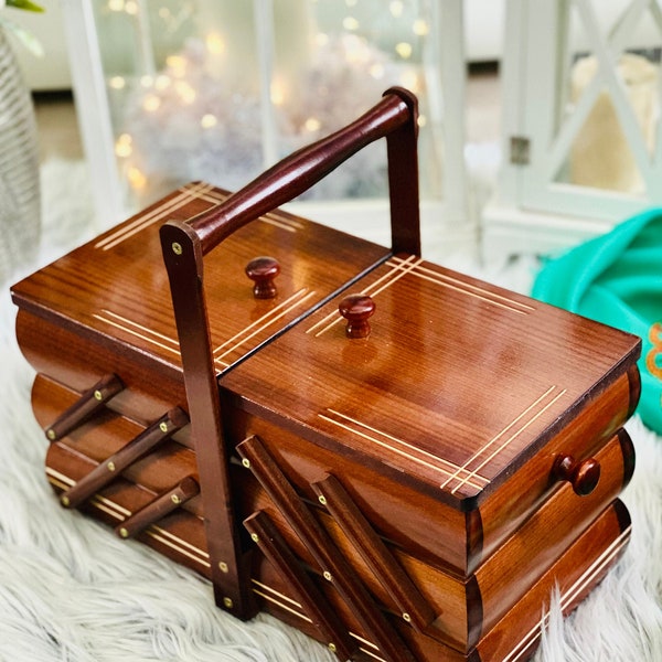 Big Wooden sewing box, alder-colour concentrina storage box, cantilevered wooden accordion box with bright carved lines on lids