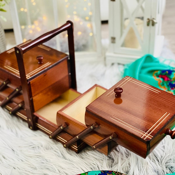 Large Wooden sewing box, alder-colour concentrina storage box, cantilevered wooden accordion box with bright carved lines on lids