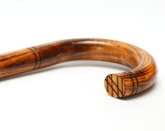 Wooden classic cane, bent elegant walking stick, natural fired wood color cane