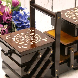 Large wooden sewing box, dark brown concentrina storage box, cantilevered wooden accordion box with carved geometric design