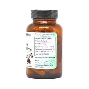 May include: A brown glass bottle with a white label containing supplement facts for a dietary supplement. The label includes the name "Ajuga Turkestanica Extract" and the dosage "600mg". The bottle is filled with capsules and has a black lid with a seal.