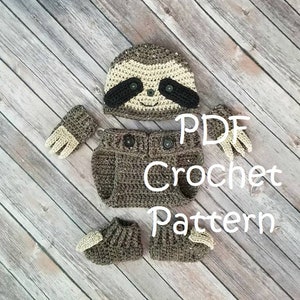 May include: Crochet pattern for a sloth baby outfit, including a hat, booties, and mittens. The pattern is available as a PDF download.