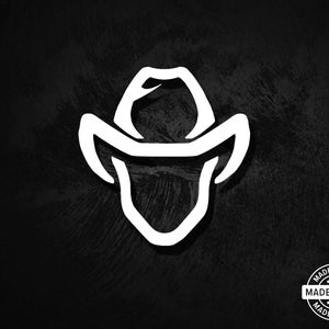 May include: White cowboy hat graphic on a black background. The hat is a stylized outline, with a curved brim and crown. The image includes a "Made in USA" seal in a circular design.