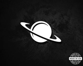 May include: White planet logo with a ring around it on a black background. The logo is a simple, minimalist design. A circular "Made in USA" sticker is in the bottom right corner.