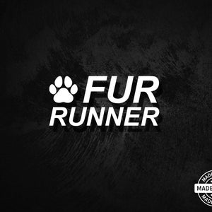 May include: White text on a black background reads "FUR RUNNER" with a paw print icon. A "MADE IN USA" seal is in the lower right corner. The background has a textured, brushstroke effect.