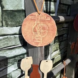 Wine windchimes - no they don’t break that easily! Sound is unique!