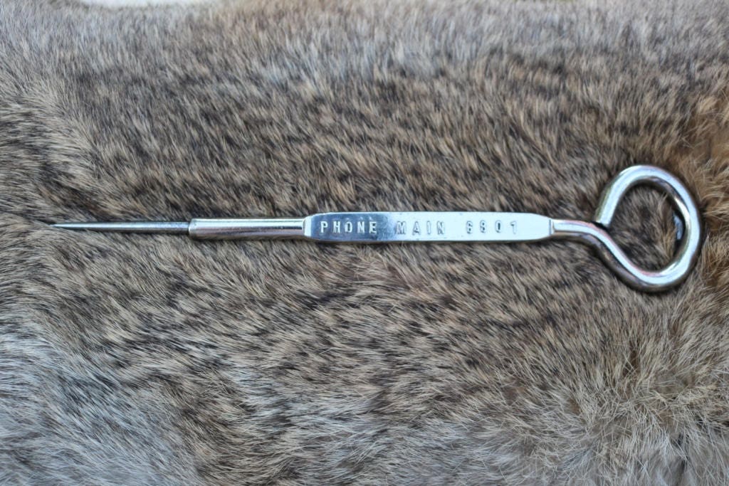 Vintage metal ice pick bottle opener from Colorado Ice and Cold Storage Co