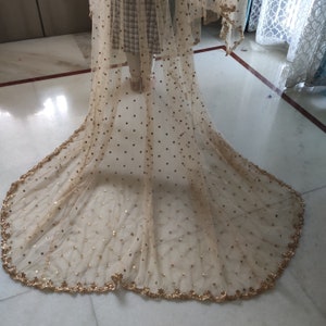 Golden net Bridal entry dupatta in Indian wedding for women. Long trail dupatta for bride's grand entry. Second dupatta Indian wedding.