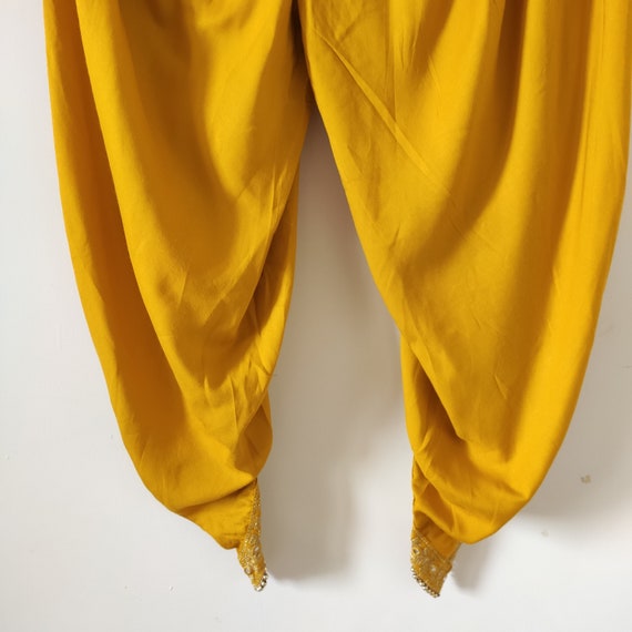 Yellow hand block printed asymmetrical kurta with dhoti pants - set of two  by Jalpa Shah | The Secret Label