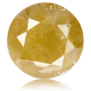 May include: A round, faceted yellow diamond with a brilliant cut. The gemstone has a warm, golden hue and a reflective surface. The diamond is set against a white background, with a subtle reflection visible below.