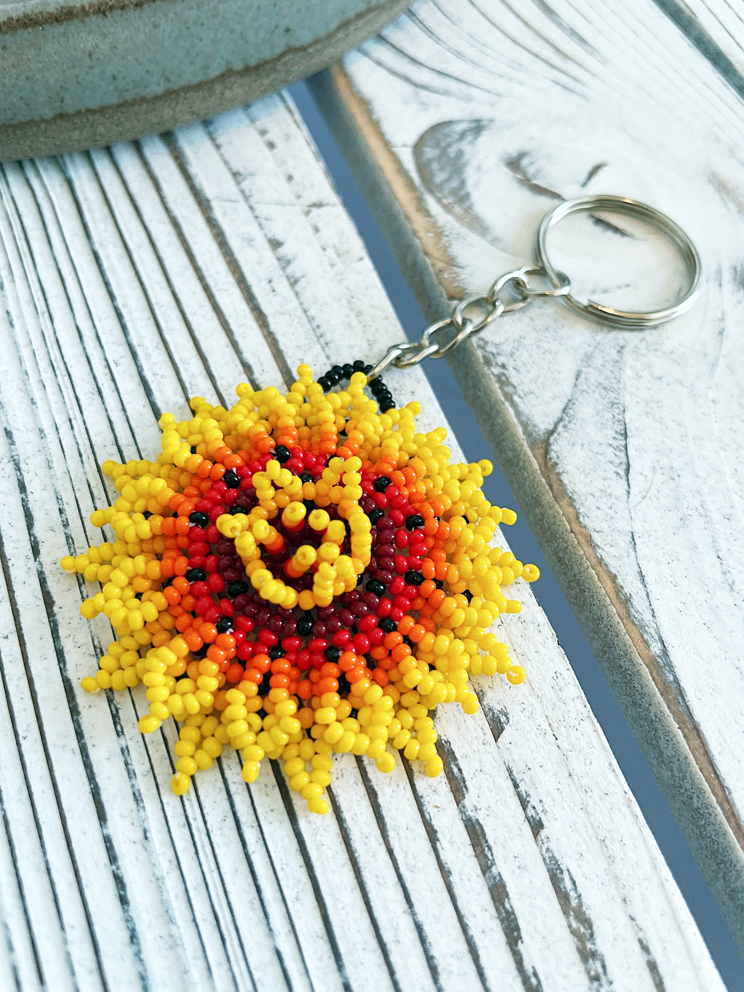 Shop Suey Boutique Hand Embroidered Floral Keychains | Handmade Flower Keychain | Boho Natural Wood Thread Tassel Orange Wildflower