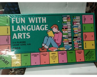 May include: A boxed board game titled "Fun With Language Arts" with a green background. The game board features a cartoon illustration of a person reading, surrounded by books. The game is designed for 2-6 players, grades 4-8.