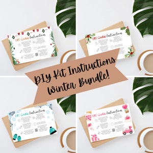 May include: Four printable cards with instructions for a DIY cookie kit. Each card has a different winter theme: Christmas, winter, Valentine's Day, and a general winter theme. The cards are on a white background with a brown wooden surface and green leaves.