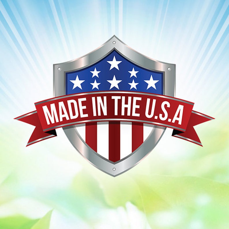 May include: A silver shield emblem with a blue top section featuring white stars, a red and white striped bottom, and a red banner that reads "MADE IN THE U.S.A." The background has a blue and green gradient.