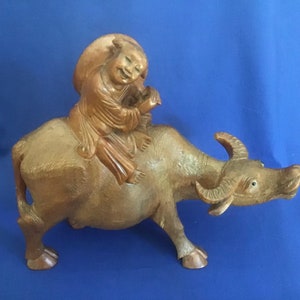 Boy Riding Wooden Water Buffalol.  Highly Collectable. BARGAIN.