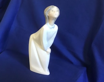 Genuine Lladro Figurine. No. 4873. Young Girl “Offering a Kiss”. Good Condition. Glazed Finish.  No chips or cracks.