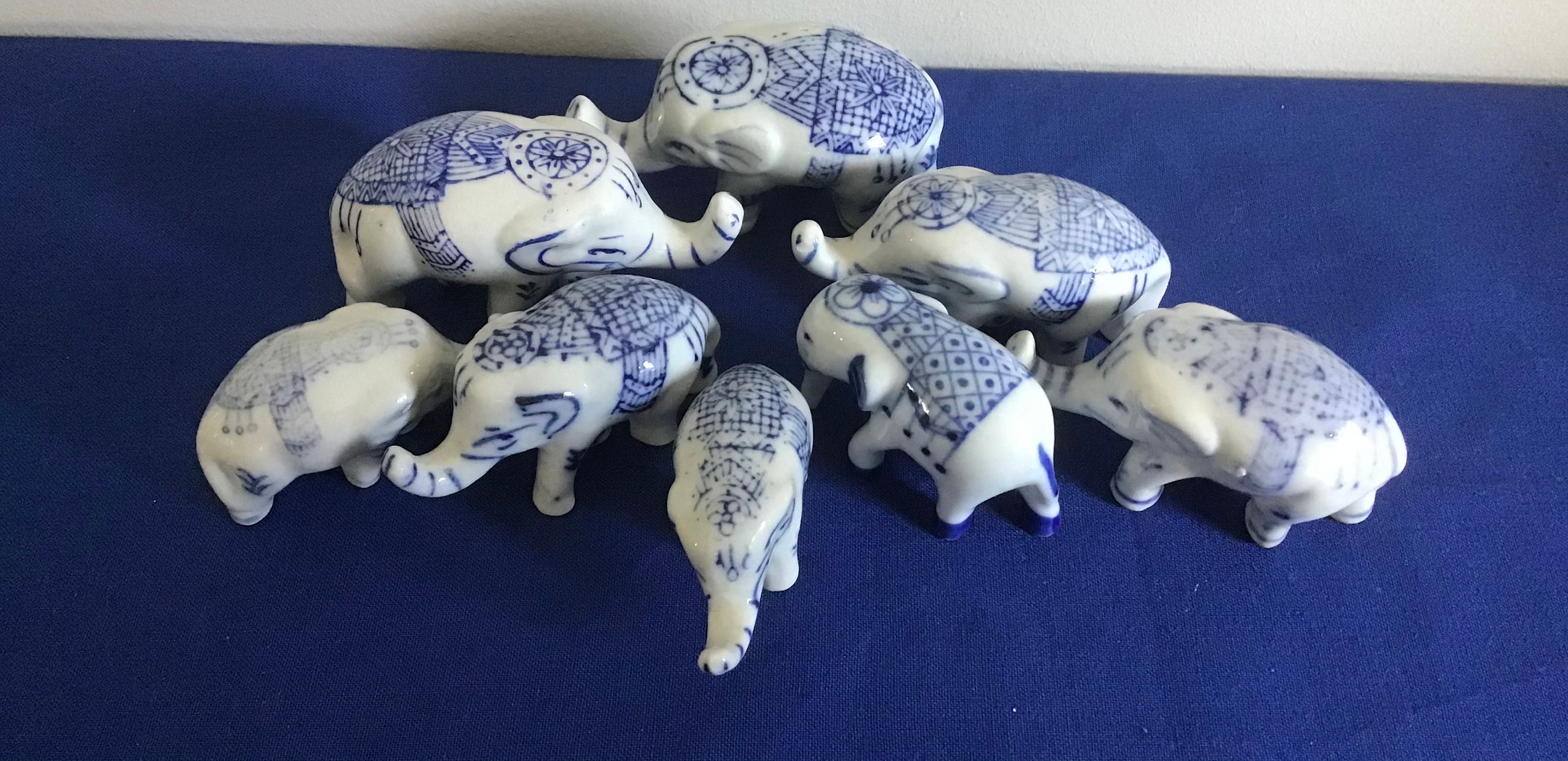 Eight Porcelain Elephants in Blue and White. These are Etsy