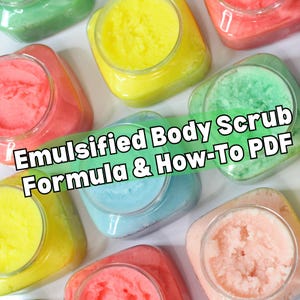 May include: An overhead shot of several clear plastic jars filled with colorful emulsified body scrub. The scrubs are in shades of pink, yellow, green, and blue. Text on the image reads "Emulsified Body Scrub Formula & How-To PDF".