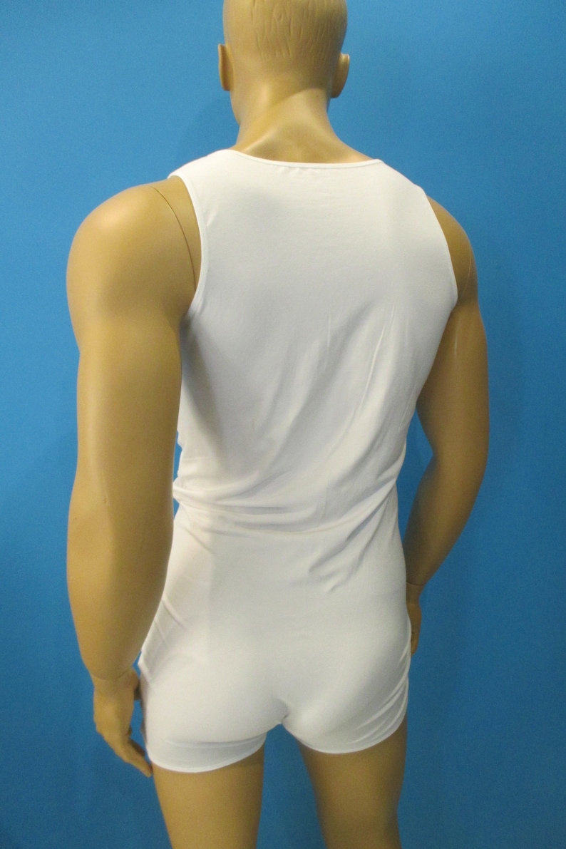 May include: White sleeveless bodysuit with a scoop neck.