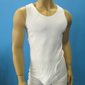 May include: White sleeveless undershirt with a built-in pouch. The undershirt is made of a smooth, stretchy fabric.