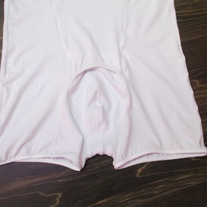 May include: White cotton underwear with a low rise and a wide waistband.