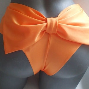 cheeky bikini  bottoms ,bow knickers ,brazilian swimming shorts , sexy orange swimwear  cut out bottom  toples beach wear , bathing suit