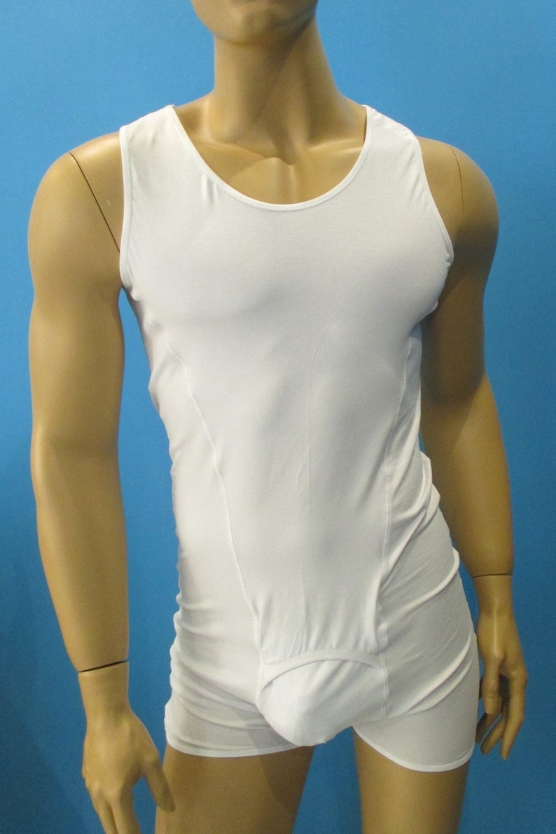 May include: White sleeveless undershirt with a built-in brief. The undershirt has a scoop neck and a smooth, seamless design.