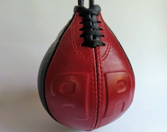 Extra extra small fast speed boxing bag made of genuine leather red and black with embossed letters smallest speed bag approximately 3x6 in