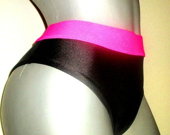 May include: Black swimsuit with a hot pink waistband.