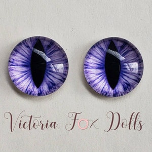 May include: Two purple cat eyes with black pupils and white highlights. The eyes are round and have a glossy finish.