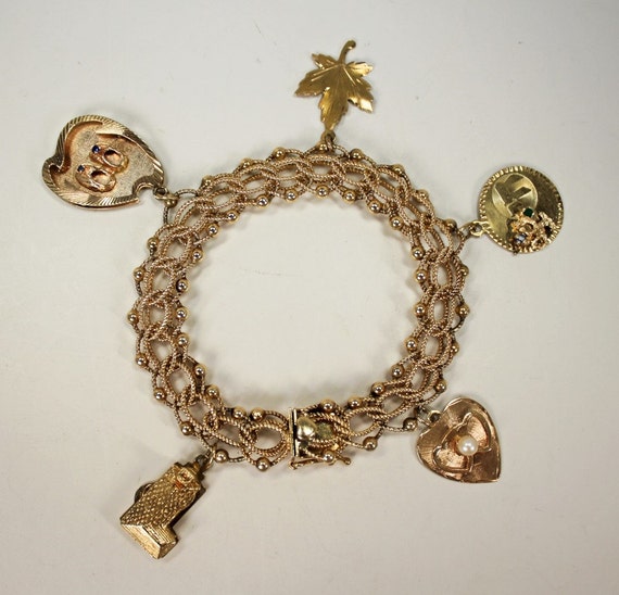 1stDibs Gold 1960s 14kt Charm Bracelet 8 Charms Retro