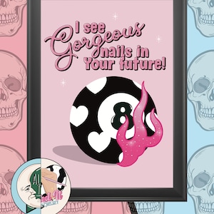 May include: Framed art print with a pink background and the text "I see Gorgeous nails in Your future!". The image features a black and white 8-ball with heart designs and a pink flame. The background has skull patterns.