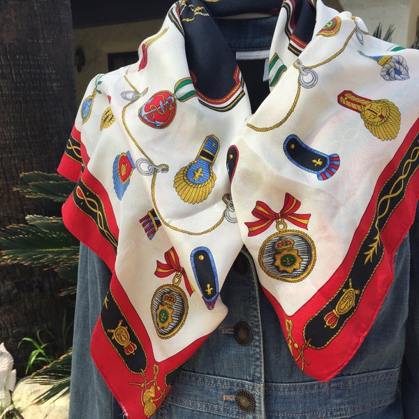 100% SILK SCARF Features Military Badges & Awards in Bold Red, Blues and Golds Crest at Center By ECHO Measures 30 x 31 inches