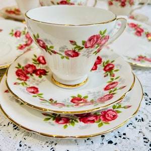 A pretty pink floral vintage teacup saucer trio set made in England