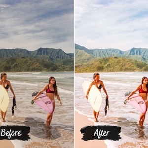 May include: Two people are walking on a beach with surfboards. The person on the left is carrying a yellow surfboard and the person on the right is carrying a pink surfboard. The beach is sandy and there are mountains in the background.