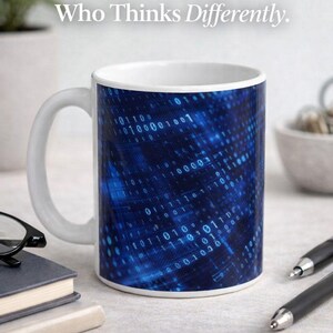 May include: White ceramic mug with a blue binary code design. The mug has the text "For the Man Who Thinks Differently" and "Smart & Funny Valentine's Gift". The mug is a unique gift idea.
