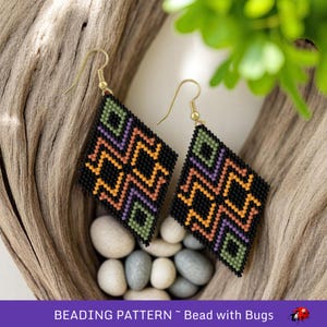May include: A pair of black, orange, green, and purple beaded earrings with a geometric pattern. The earrings are diamond shaped and have gold hooks. "BEADING PATTERN ~ Bead with Bugs" is written at the bottom of the image.