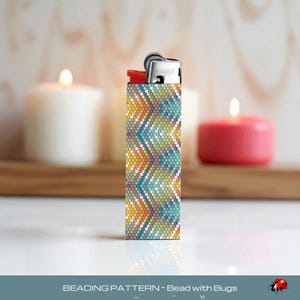May include: A decorative lighter featuring a chevron pattern in blue, yellow, and white. The background includes lit candles. The text "BEADING PATTERN - Bead with Bugs" is visible at the bottom of the image.