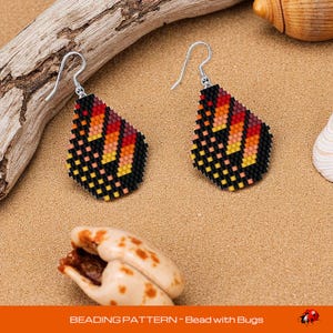 May include: A pair of beaded teardrop earrings with a vibrant pattern of black, orange, yellow, and pink squares. The earrings have silver-colored hooks. The image also includes the text "BEADING PATTERN - Bead with Bugs".