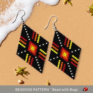 May include: A pair of black diamond-shaped earrings with a beaded design featuring a red, orange, and yellow sunburst pattern. The earrings are made with black, red, orange, and yellow beads.