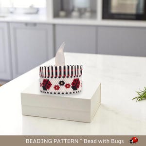 May include: A white beaded candle holder with a black and white striped band and a red and black ladybug design. The text "BEADING PATTERN - Bead with Bugs" is at the bottom of the image.