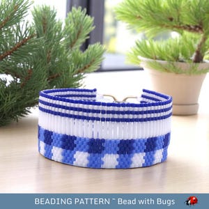 May include: A blue and white beaded bracelet with a gingham pattern. The bracelet is made with small, round beads and has a simple, elegant design.