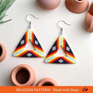 May include: A pair of triangle-shaped earrings with a black, white, red, and yellow geometric pattern. The earrings are made with seed beads and have silver hooks.
