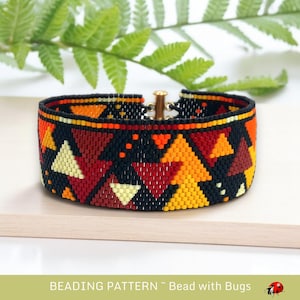 May include: A beaded bracelet with a geometric pattern in shades of red, orange, yellow, and black. The bracelet is made with small, colorful beads and has a metal clasp.