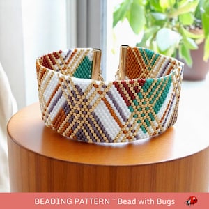 May include: A beaded bracelet with a geometric pattern in shades of white, brown, gold, green, and purple. The bracelet is made with small seed beads and has a clasp closure.