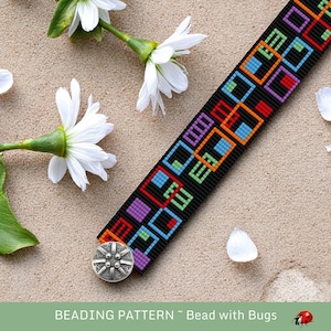 May include: A black beaded bracelet featuring a geometric pattern in red, orange, blue, green, and purple squares. The bracelet has a silver button clasp. White flowers and petals are scattered around the bracelet on a sandy surface. The text "BEADING PATTERN ~ Bead with Bugs" is at the bottom.