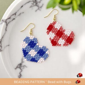 May include: A pair of beaded heart earrings, one red and white, the other blue and white. The earrings are on a white plate with the text "BEADING PATTERN - Bead with Bugs".