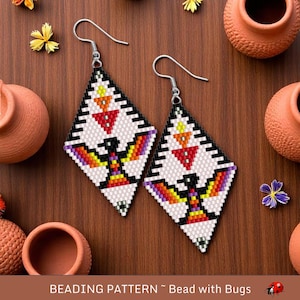 May include: A pair of beaded earrings with a white background and colorful geometric patterns. The earrings are shaped like diamonds and feature a bird design with red, orange, yellow, purple, and black beads. The earrings are hanging from silver hooks.
